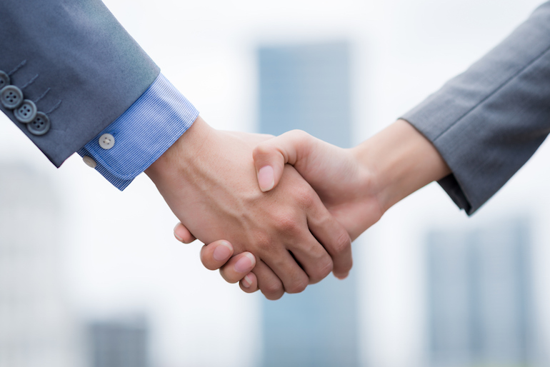 Close-up image of business people shaking hands